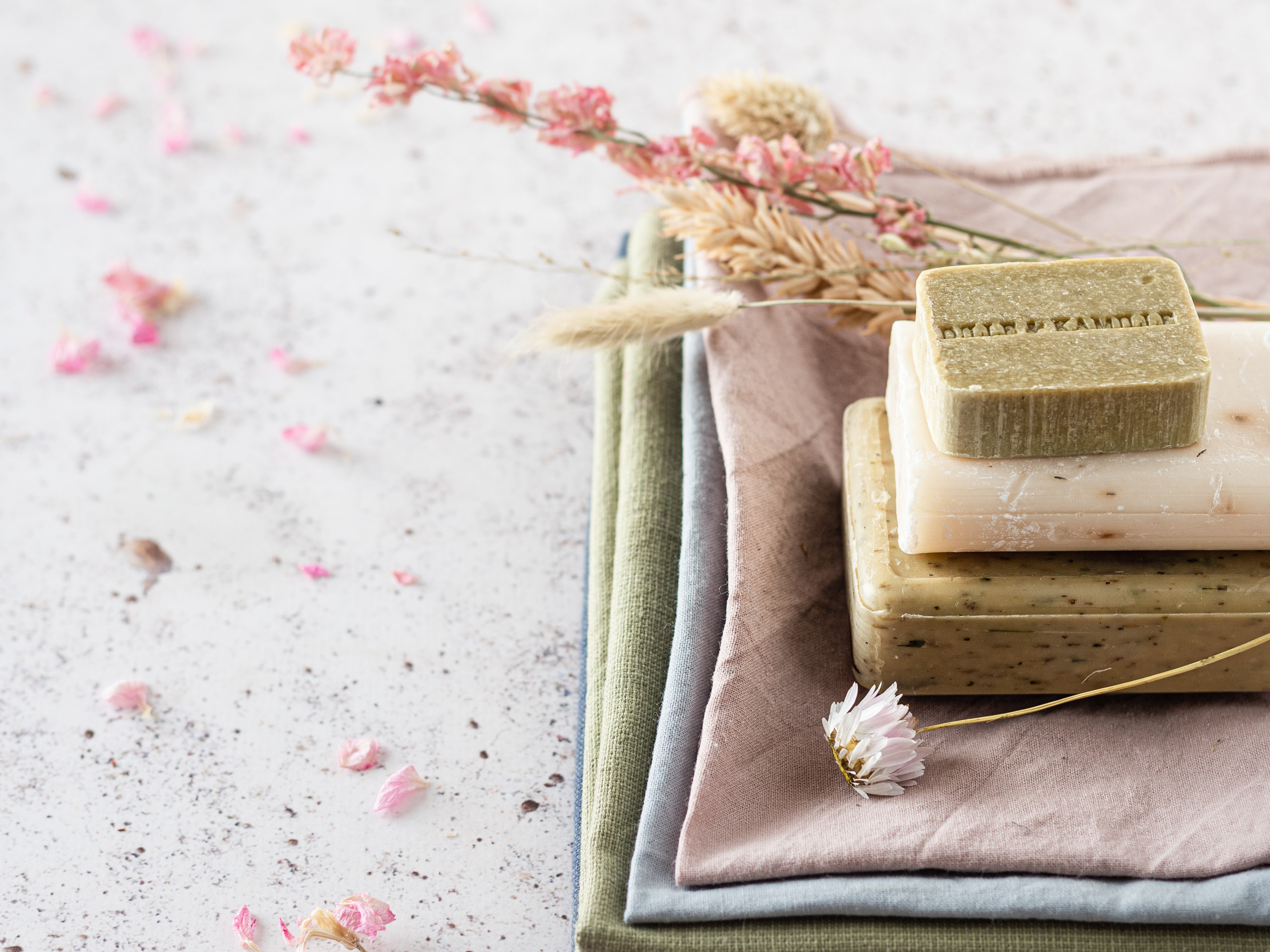 Natural soap and cloths with dried flowers